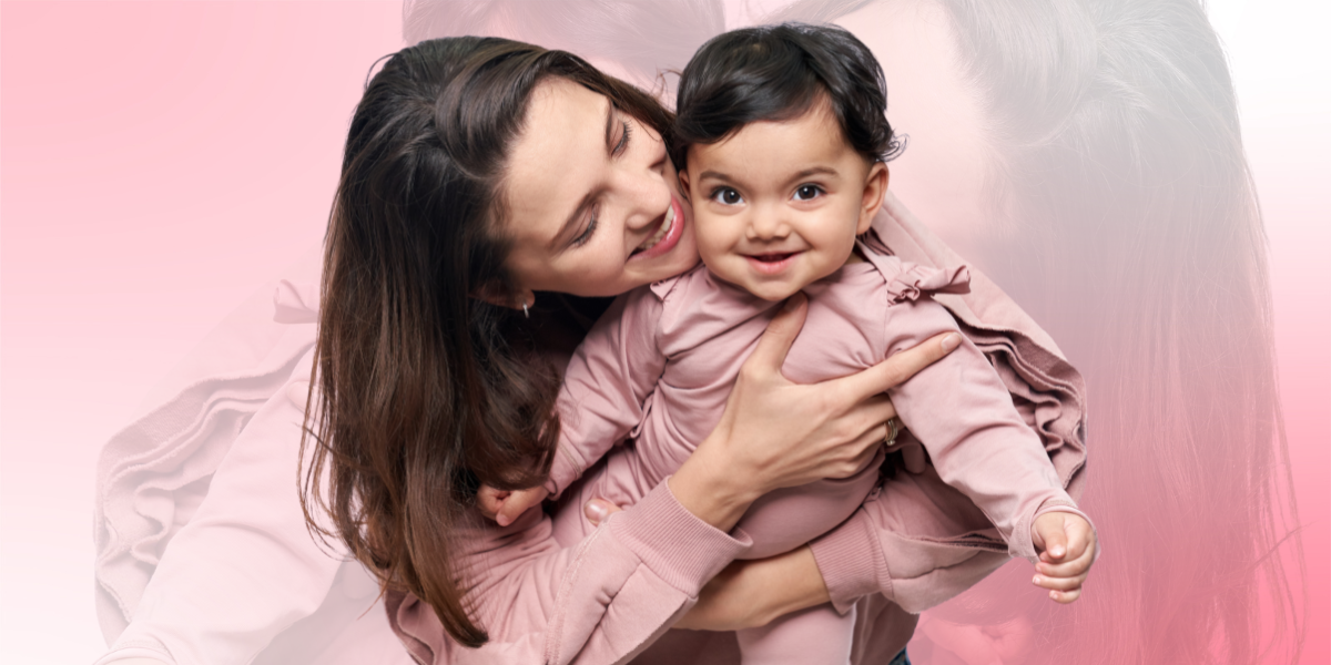 Happy lactating mother with the baby